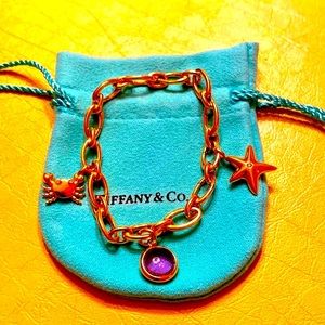 Tiffany & Co. 18kt oval link bracelet with rare charms